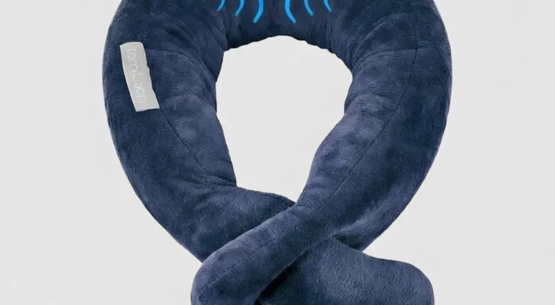 Travel neck pillow with soothing vibration massage feature